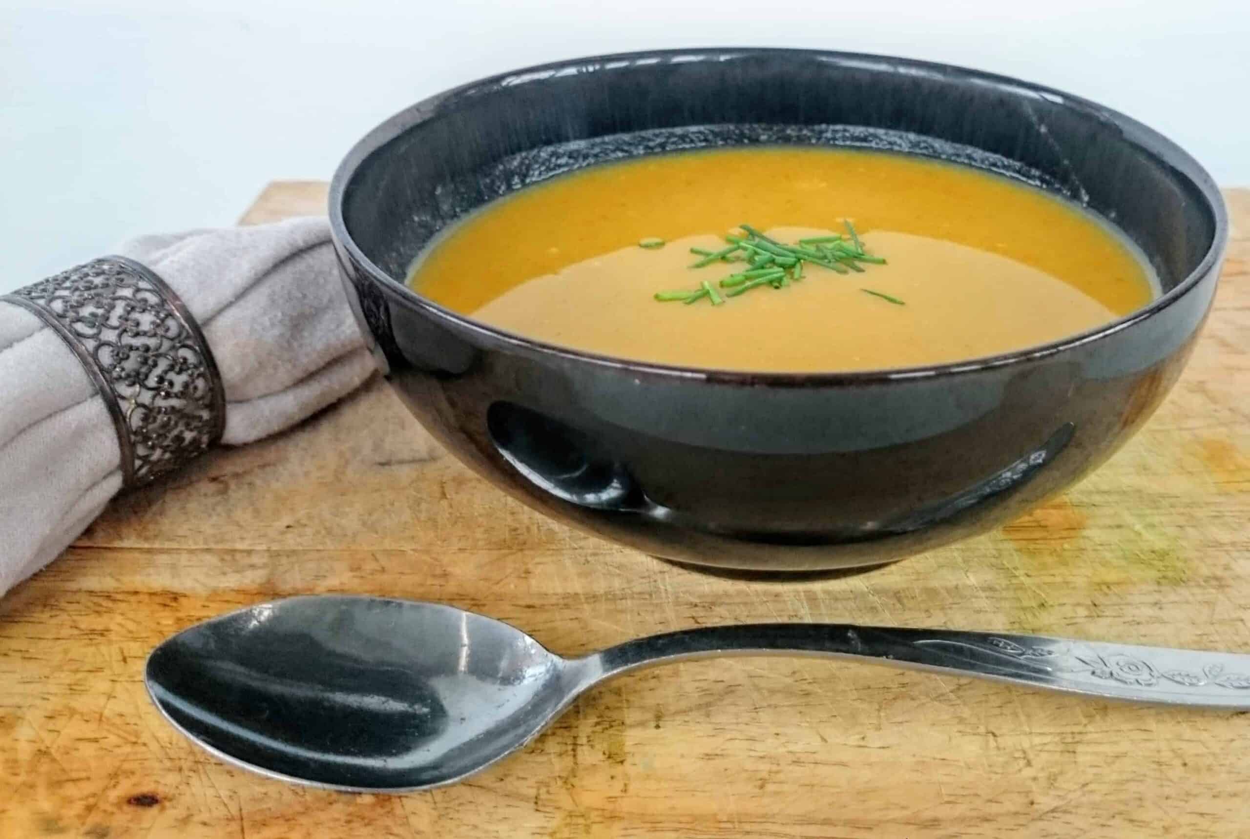 Slimming World Syn Free Pumpkin, Broccoli & Chilli Soup Maker Recipe in black bowl