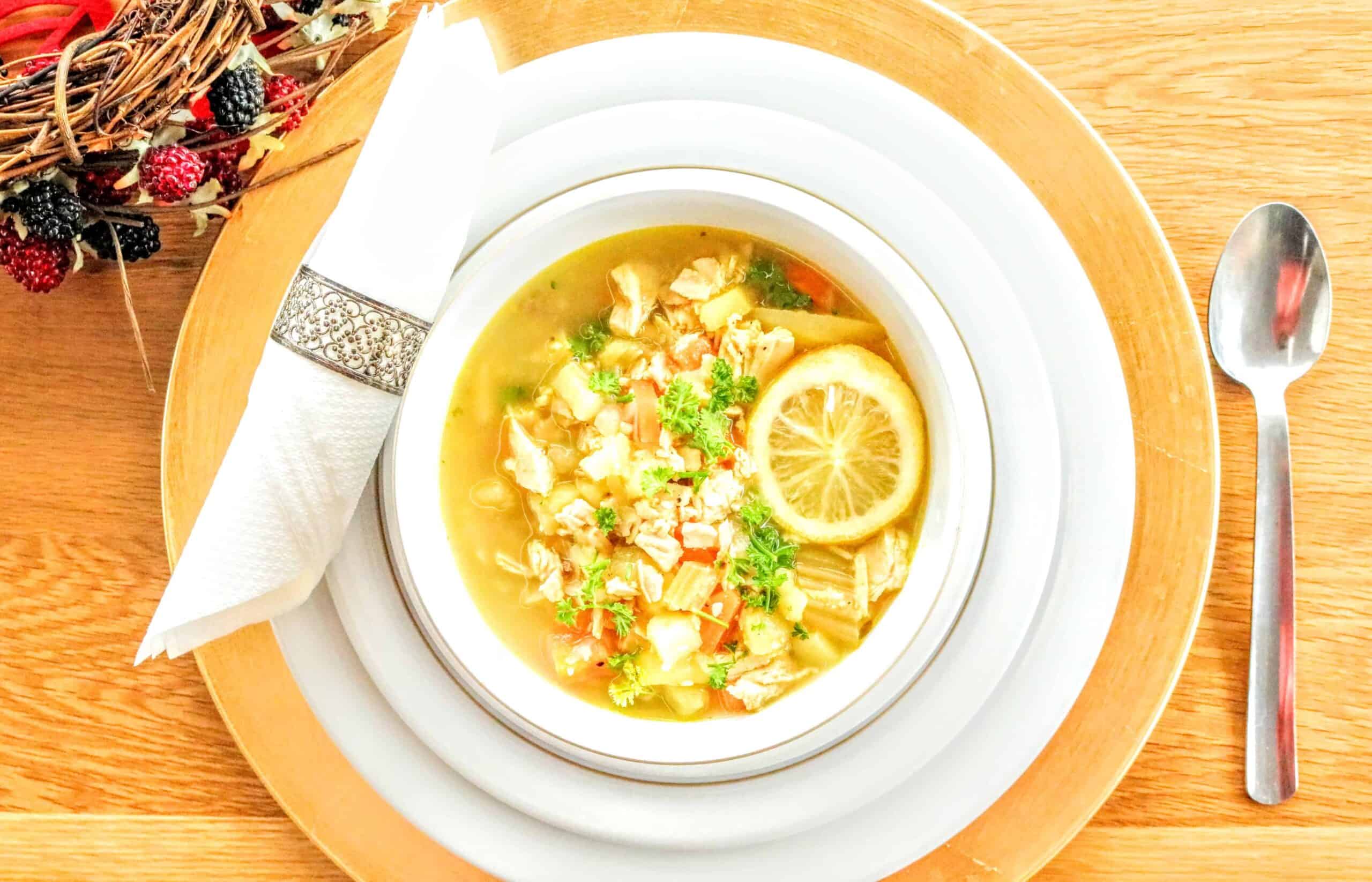 Syn Free Leftover Christmas Turkey, Ginger & Lemon Soup in white bowl with napkin ring