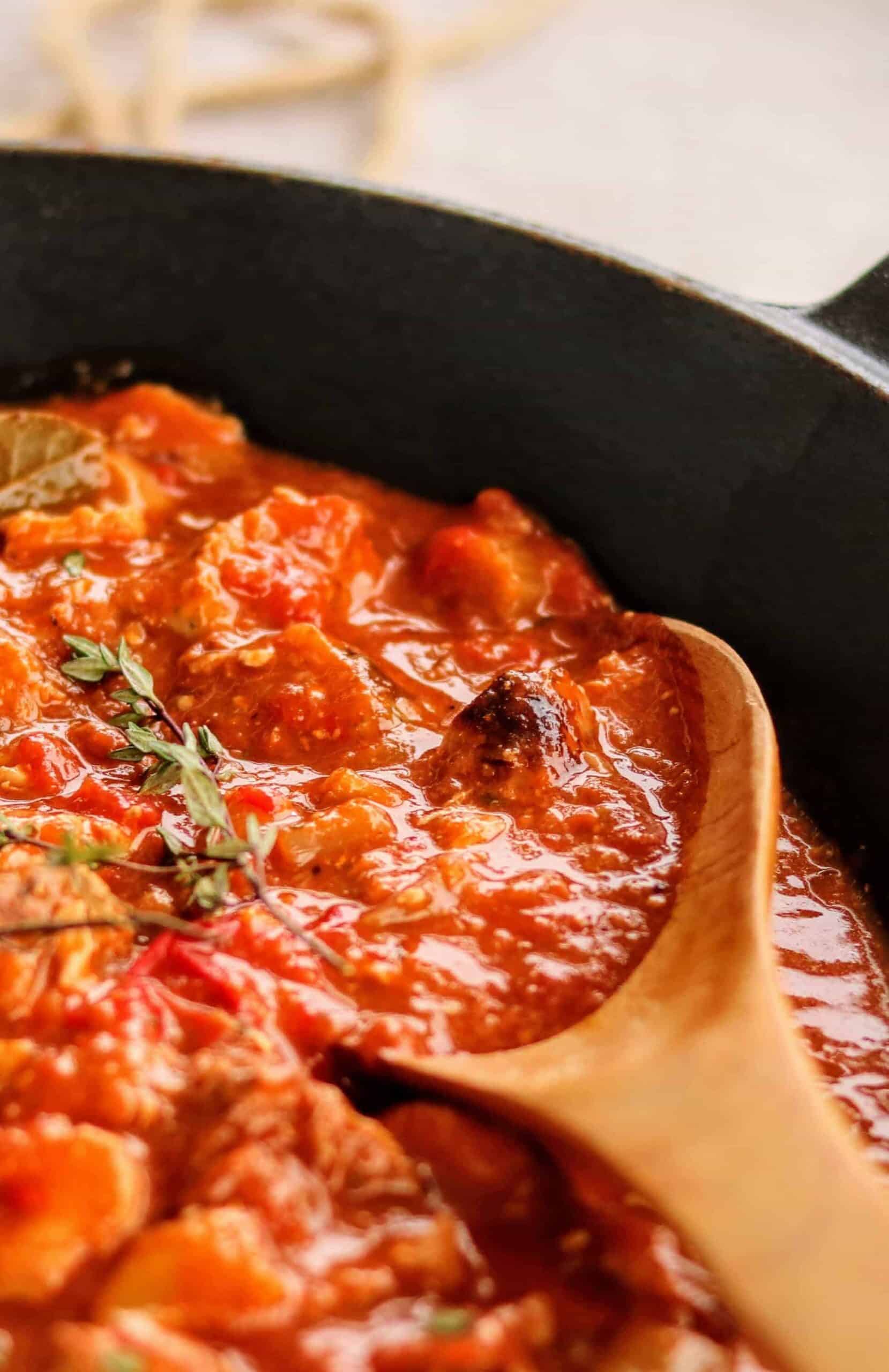 close up of a saucy gumbo recipe in one pan