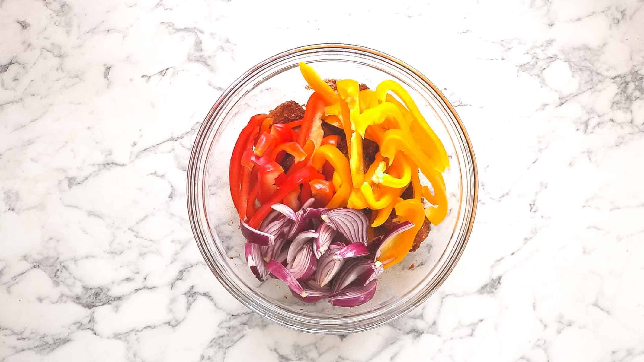 peppers and onion for chicken fajita traybake
