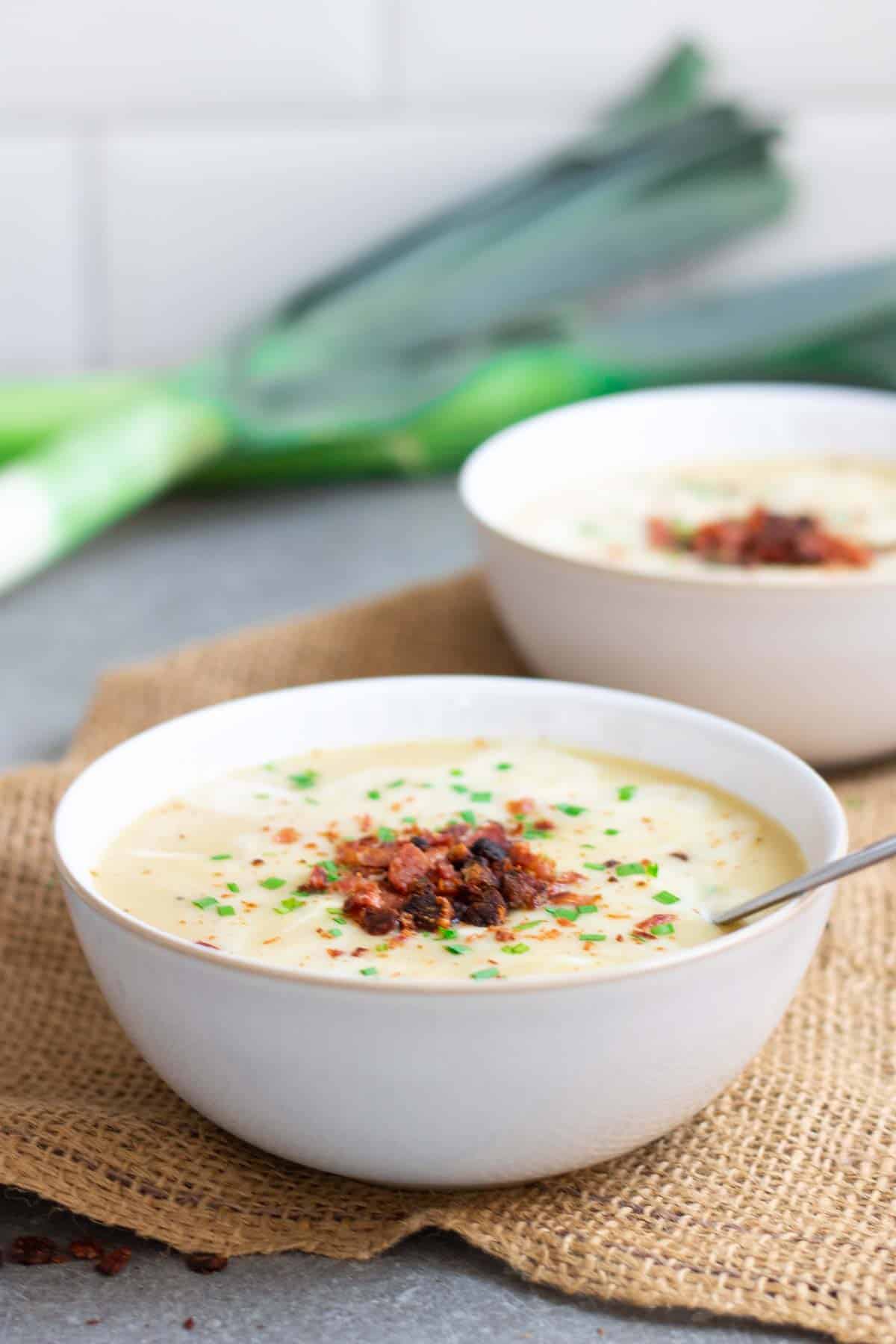 bowls of creamy vegetable soup on hessian sack