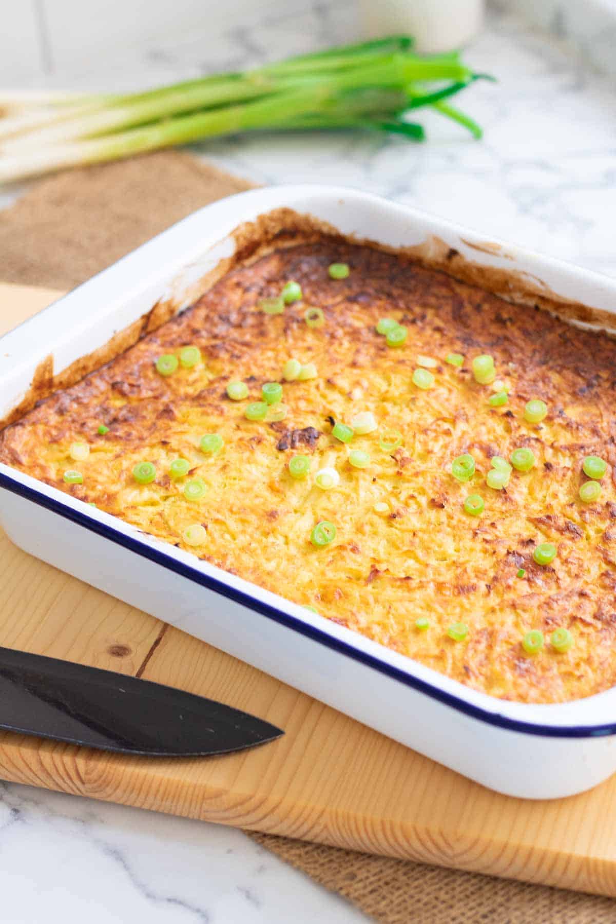 baked potato pudding topped with spring onions