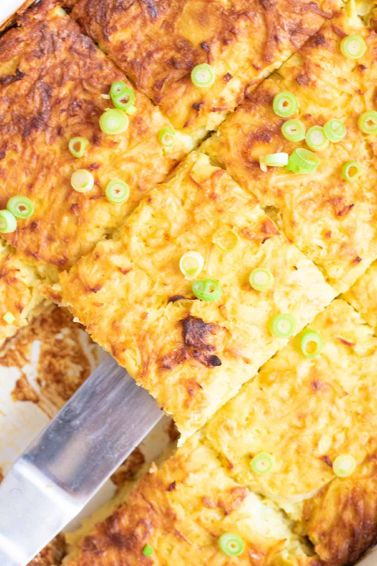 Close up of a kugel recipe cut into squares