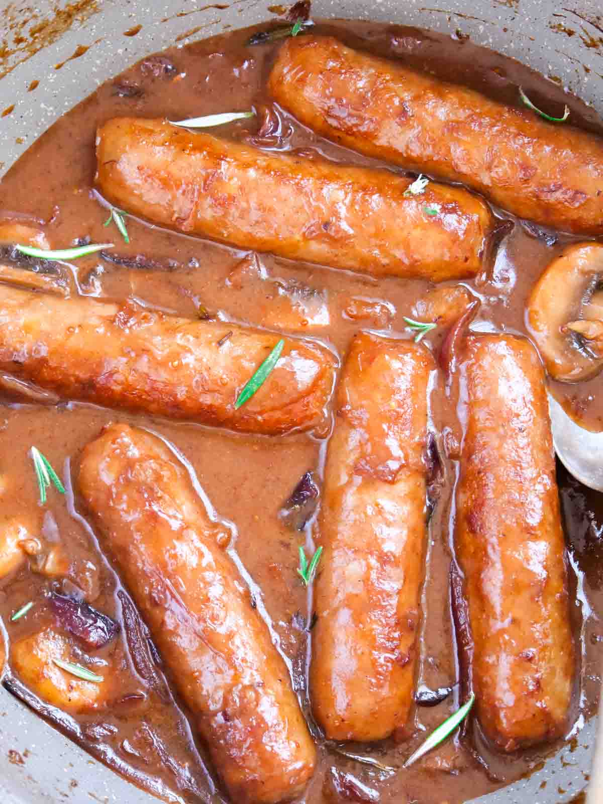 Sausages cooked in a red wine, mushroom and onion gravy and fresh rosemary.