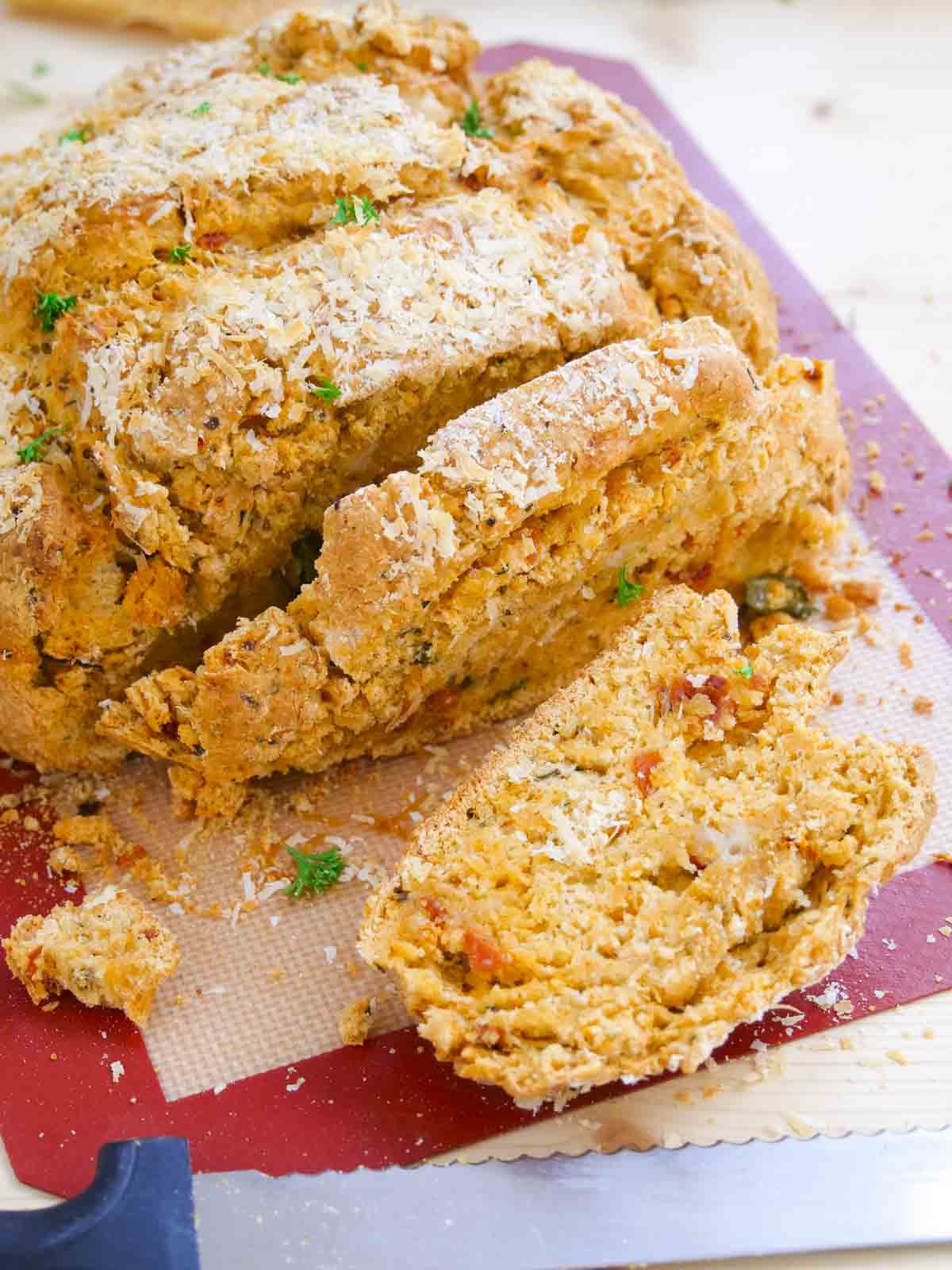 bush bread, sliced and topped with parmesan cheese and fresh parsley