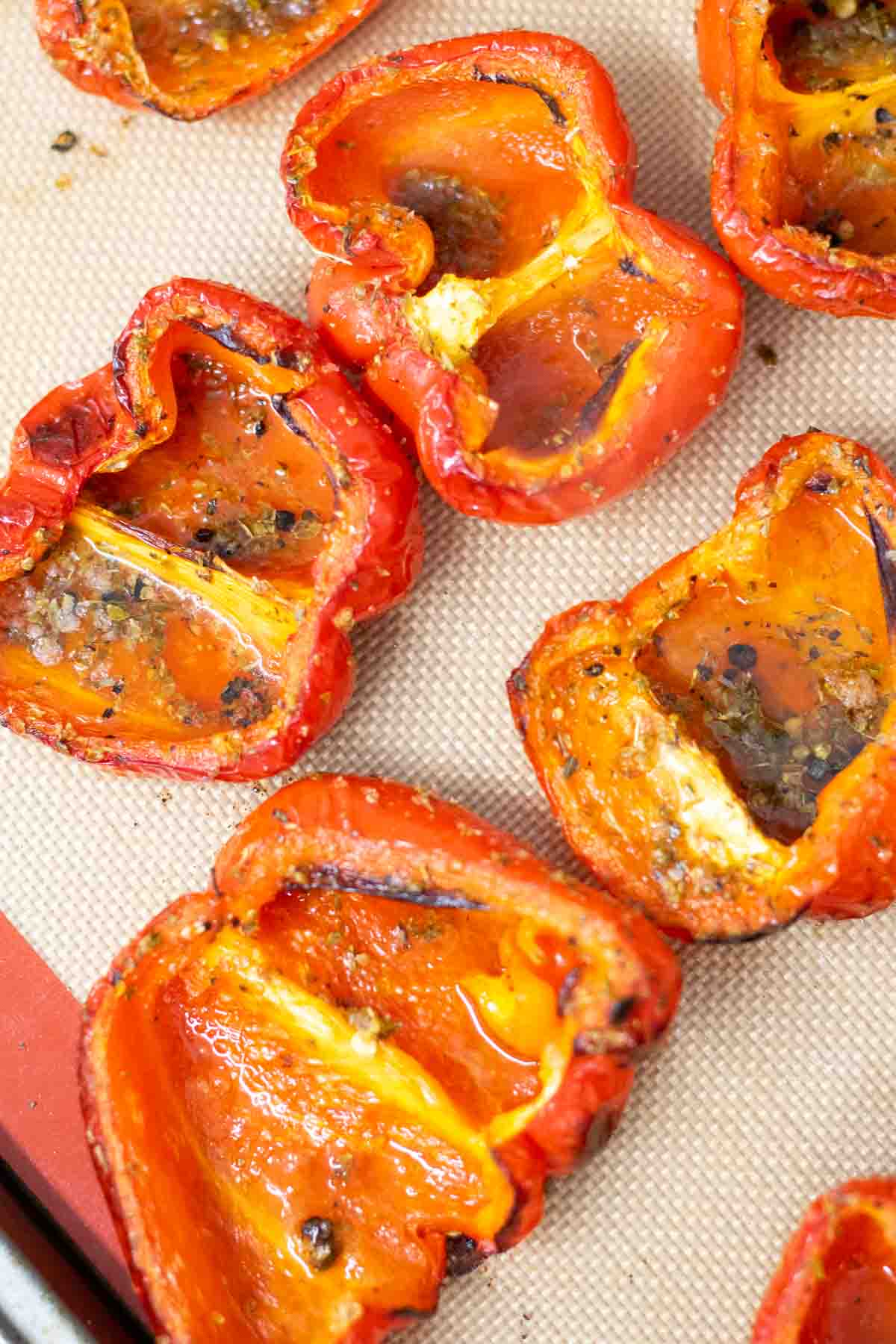 Process shots of making soup using roasted red pepper after roasting in the oven on a silicone baking mat