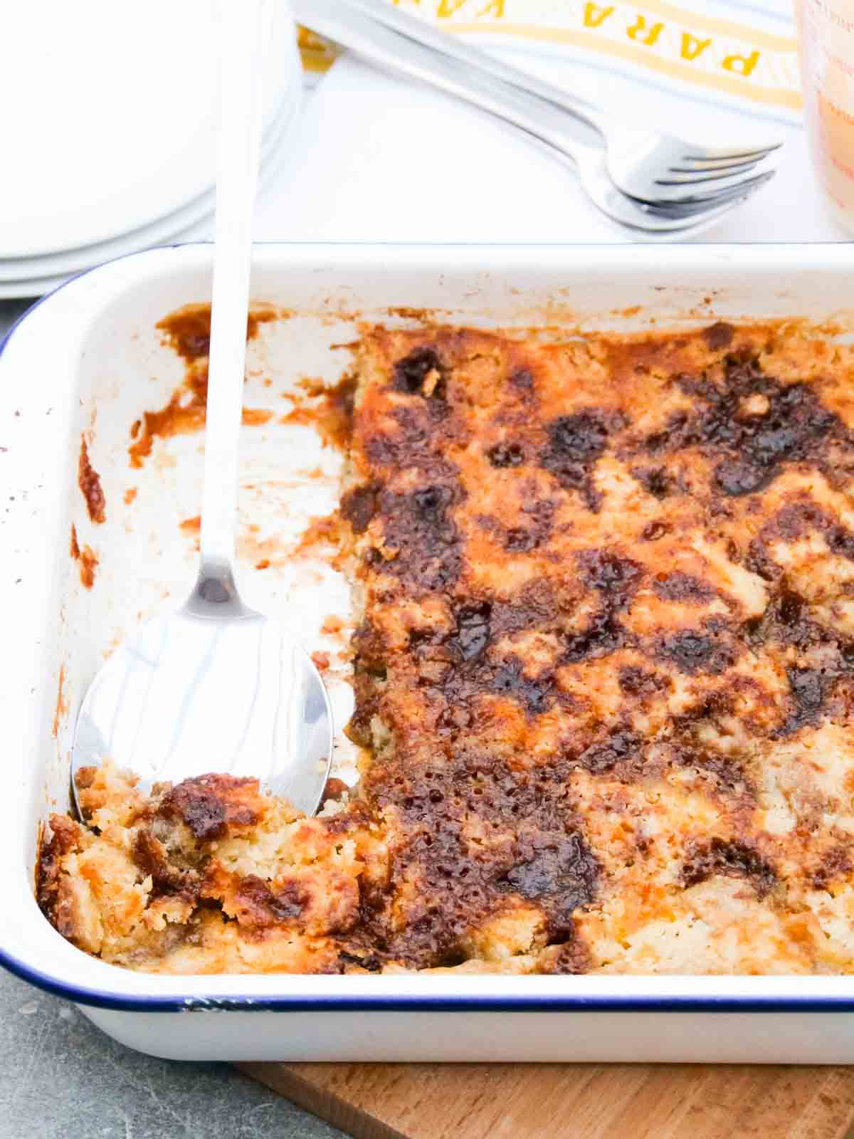 Serving easy toffee pudding from a 20 x 30cm baking tray