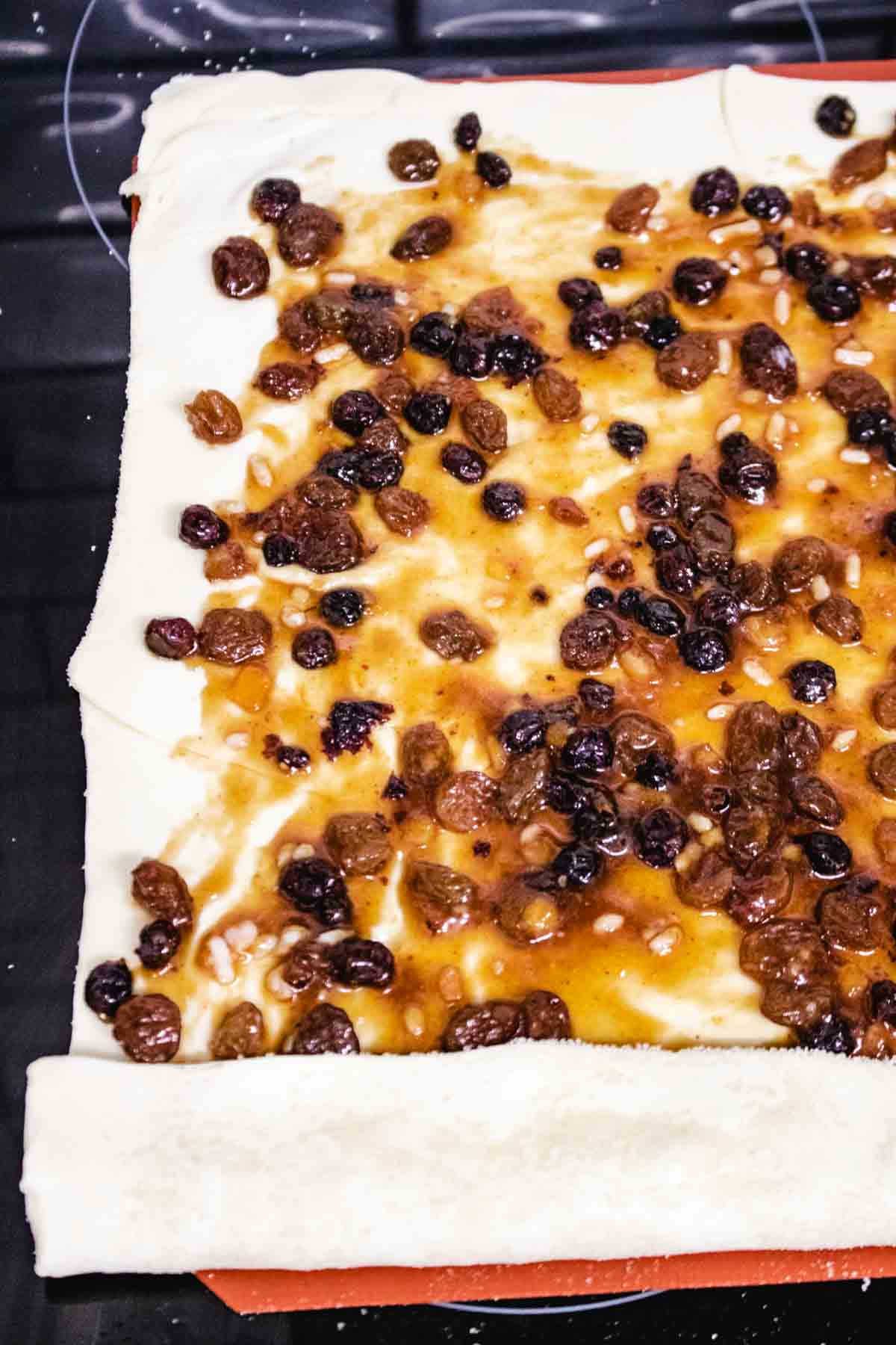 ready made mincemeat spread on a sheet of puff pastry