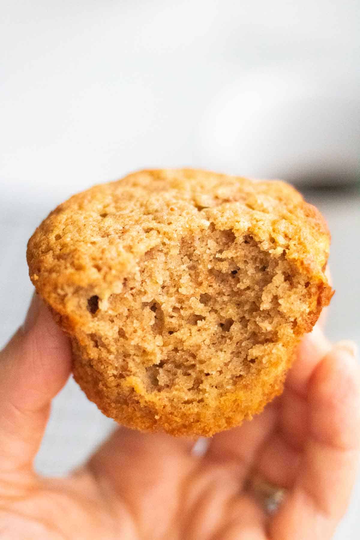Close up of the texture of a banana buckwheat pound cake baked into muffins and partially eaten