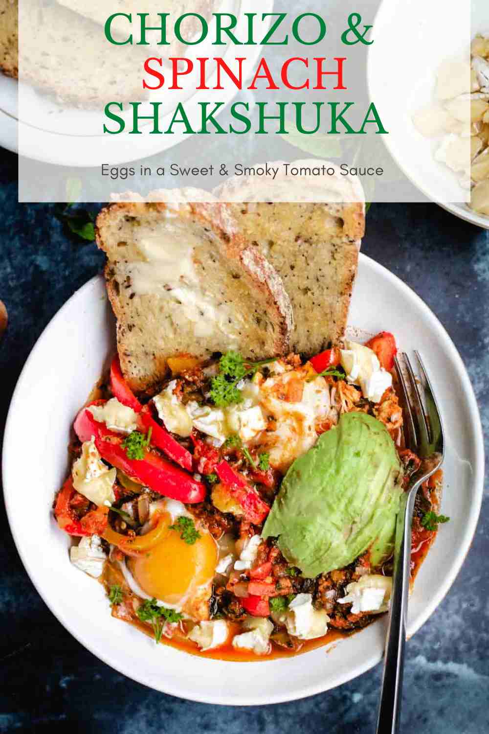 White Denby bowl full of Mexican Shakshuka with eggs, red peppers, brie and avocado