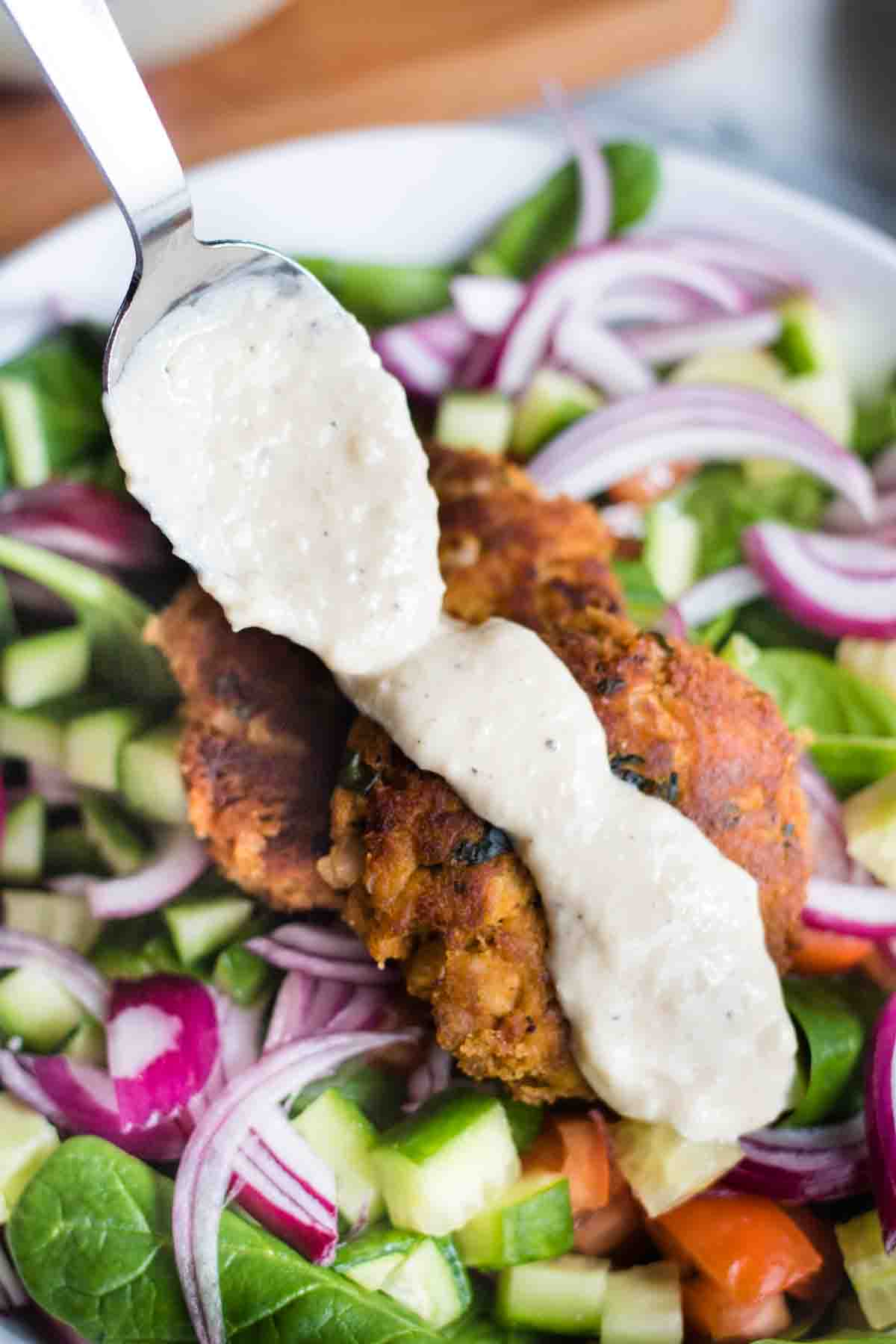 Smoked mackerel fishcakes with herb crème fraîche and little gem and apple  salad Recipe | Recipes from Ocado