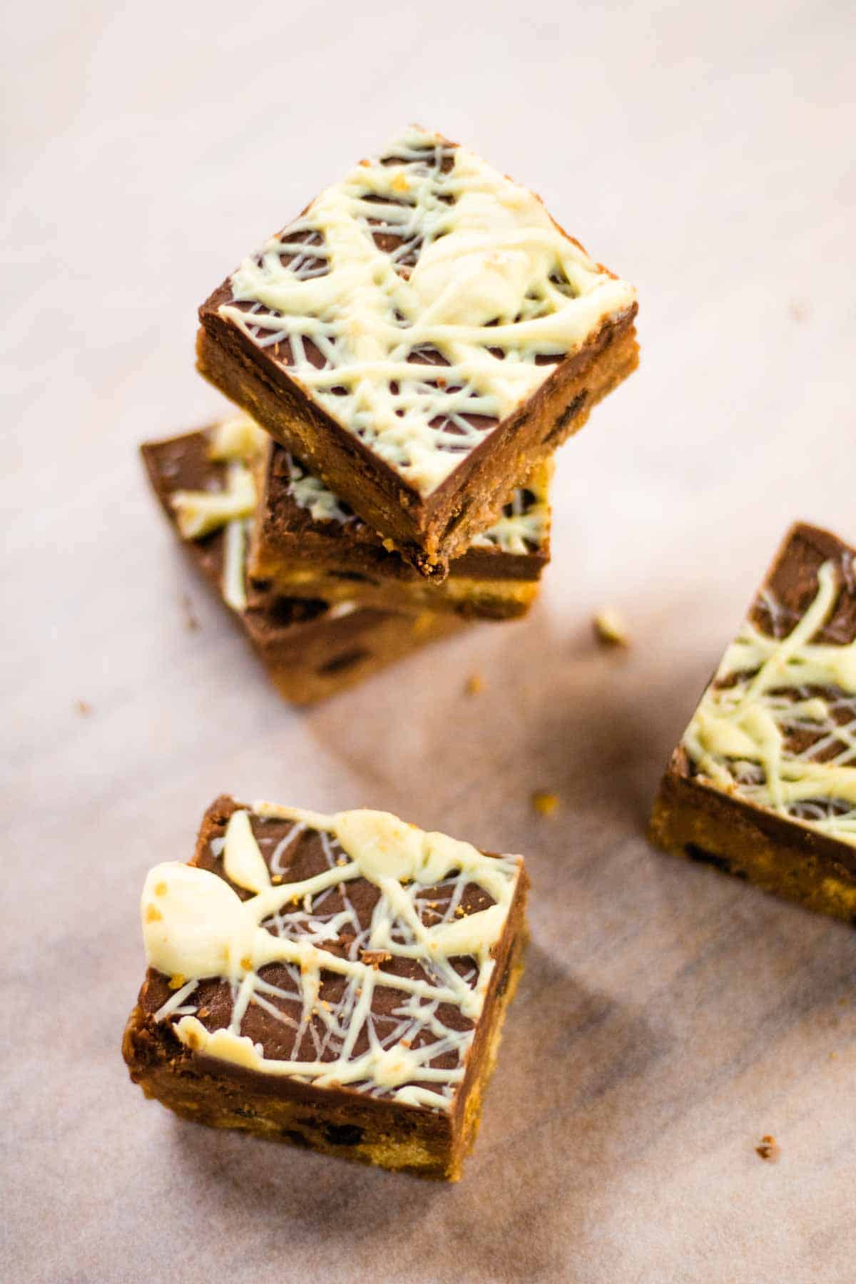 Squares of chocolate Christmas fridge cake squares on baking paper