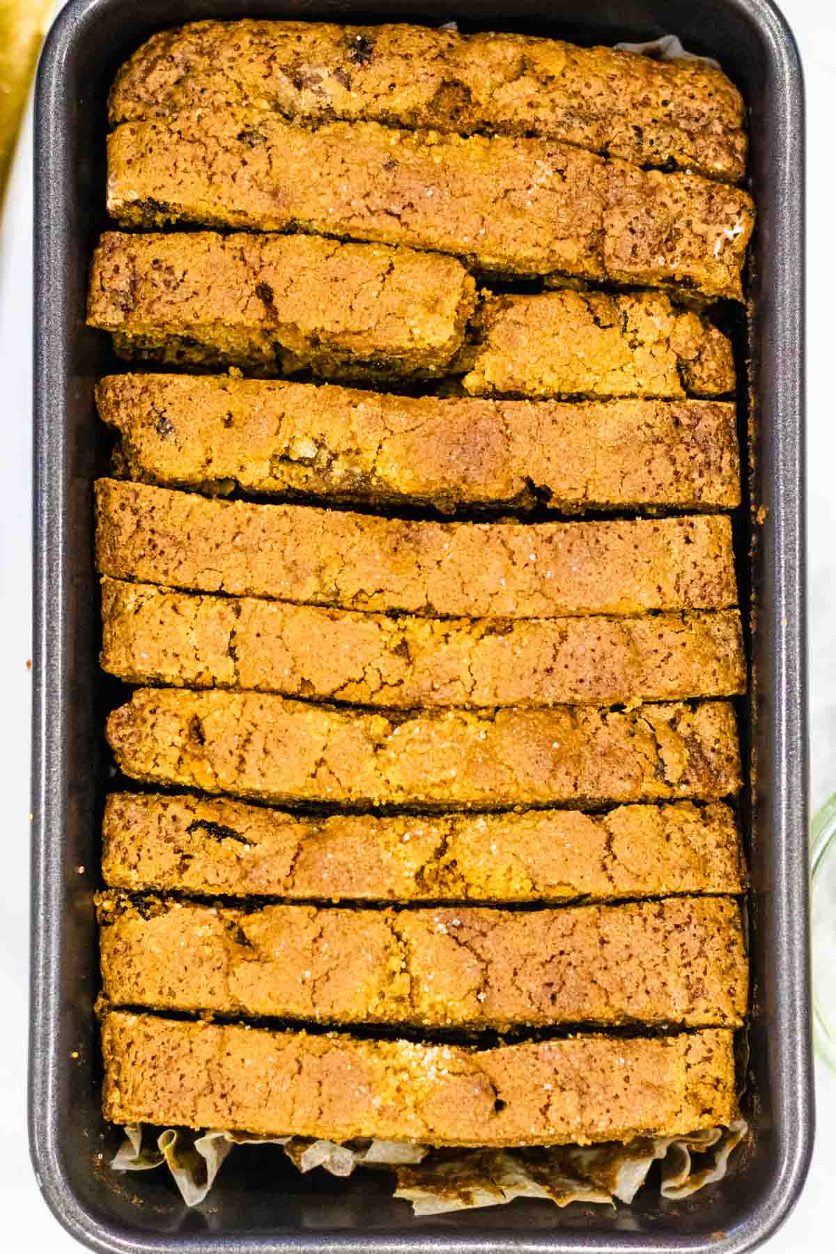 Sliced tea brack cake stored in a 2lb baking pan