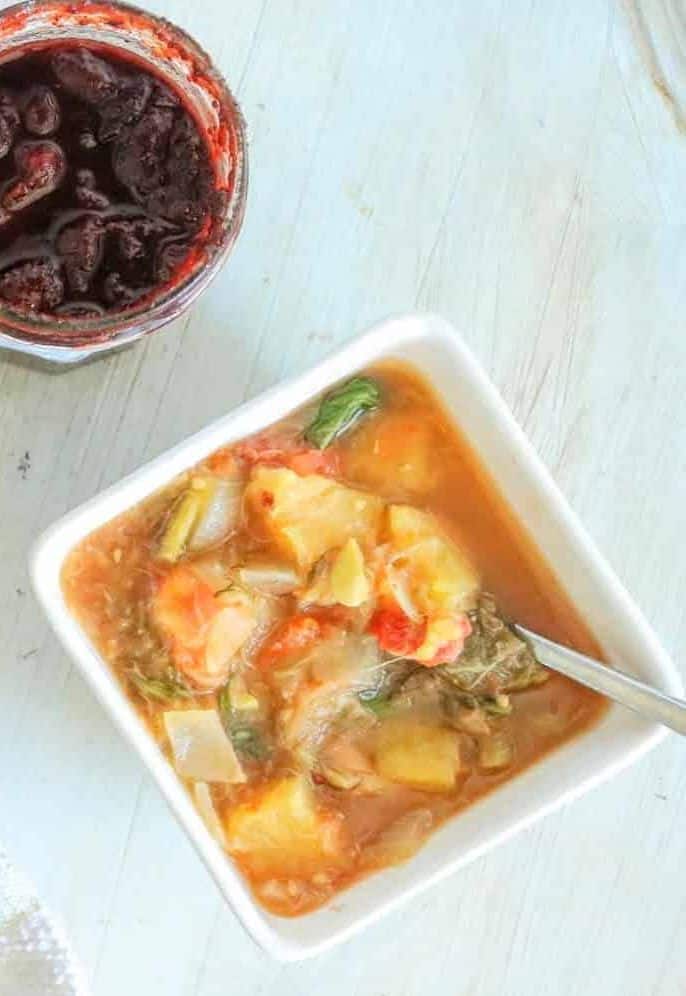 rhubarb and vegetable soup in a square bowl