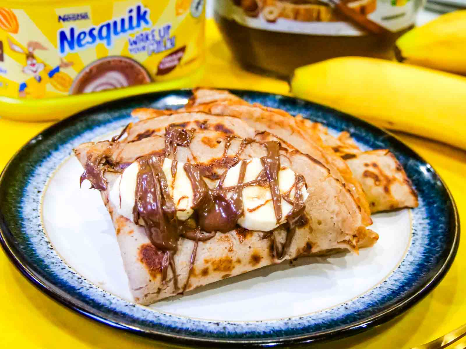 Folded crepe traditional pancakes with chocolate and banana