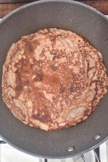 Baked chocolate pancake in a frying pan
