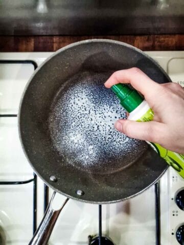 spraying a frying pan with frylight cooking oil spray