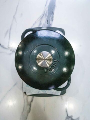 pressing tofu at home using a heavy cast iron Dutch oven