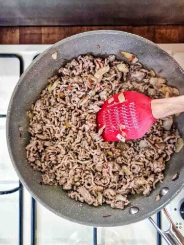 frying minced meat in a pan