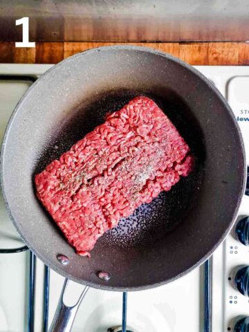 raw beef mince with salt, pepper and Fry Light in a large frying pan ready to cook