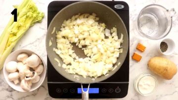 frying onions and garlic in a frying pan on induction hob