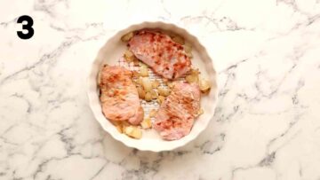 quiche dish layered with fried onions and bacon at bottom