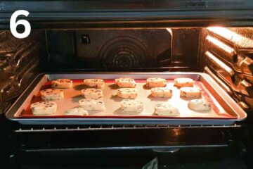 round biscuits placed in the oven on a baking tray lined with a silicone mat