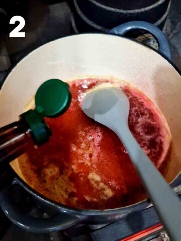red wine vinegar being added to the butter and sugar in a dutch oven