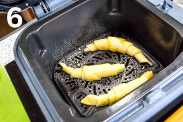 3 croissants in Ninja speedi air fryer before baking