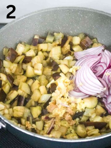 red onions, garlic and gingers with pan fried aubergine in large skillet