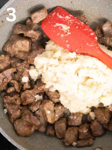 onion paste added to browned beef in a frying pan