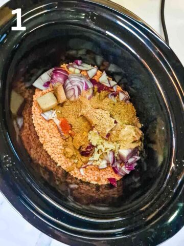 dry ingredients and vegetables added to slow cooker pot