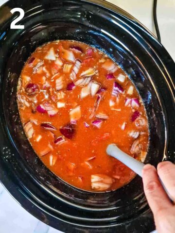 canned tomatoes and tomato puree added to crockpot for slow cooker lentil curry
