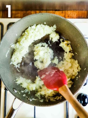 person frying grated onions, garlic and ginger for the base of a curry paste