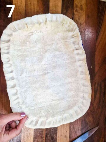 person pinching pastry edge for a fluted pie pastry effect