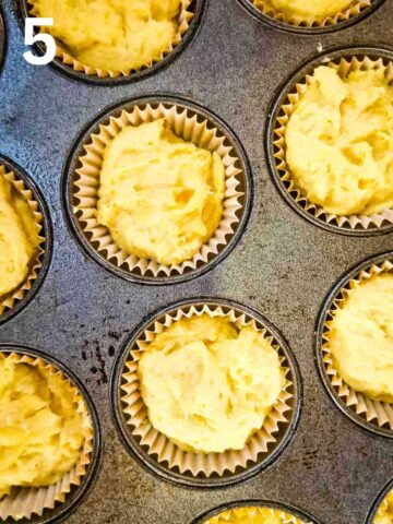 lemon cupcake batter filled into cupcake cases in a cupcake pan