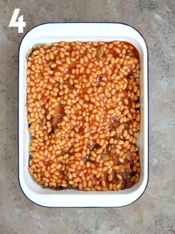 beans layered on a full english traybake