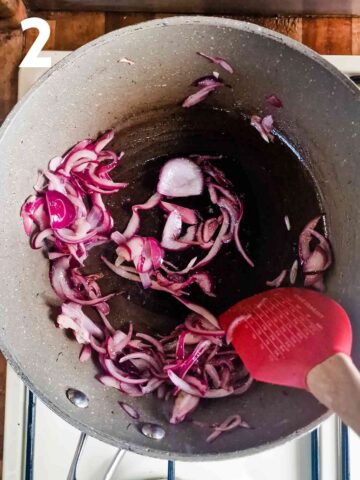 person caramelising red onions in butter in frying pan
