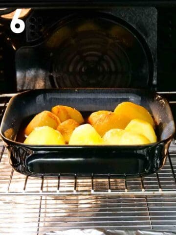 OXO roast potatoes in a dish baking in the middle of an oven
