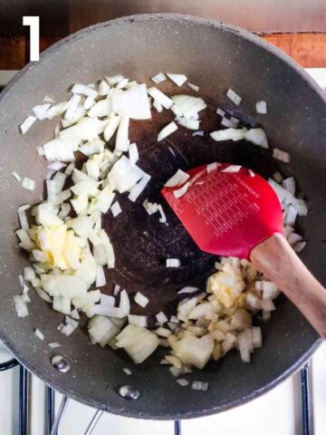 person sauteing diced onions in large pan with butter