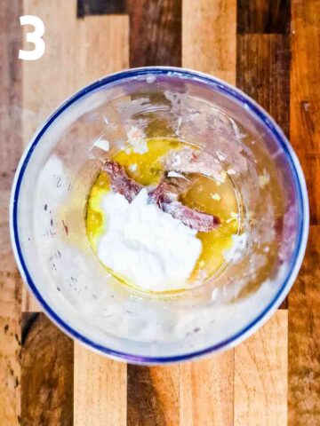 ingredients for creamy tuna and anchovy sauce in a stick blender pot