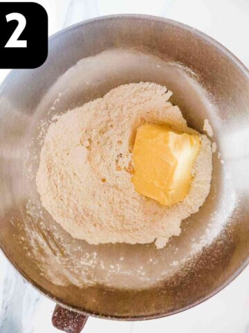 block of softened butter and vanilla extra in flour and baking powder in mixing bowl