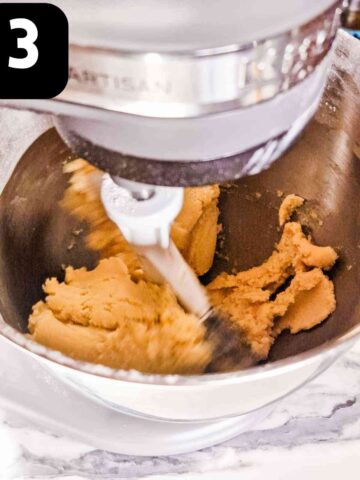 cookie dough being formed in a kitchen aid stand mixer
